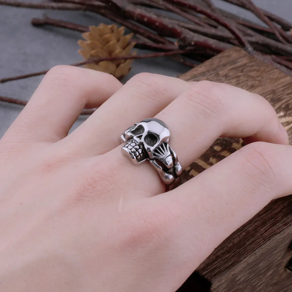 Hand Holding Skull Ring