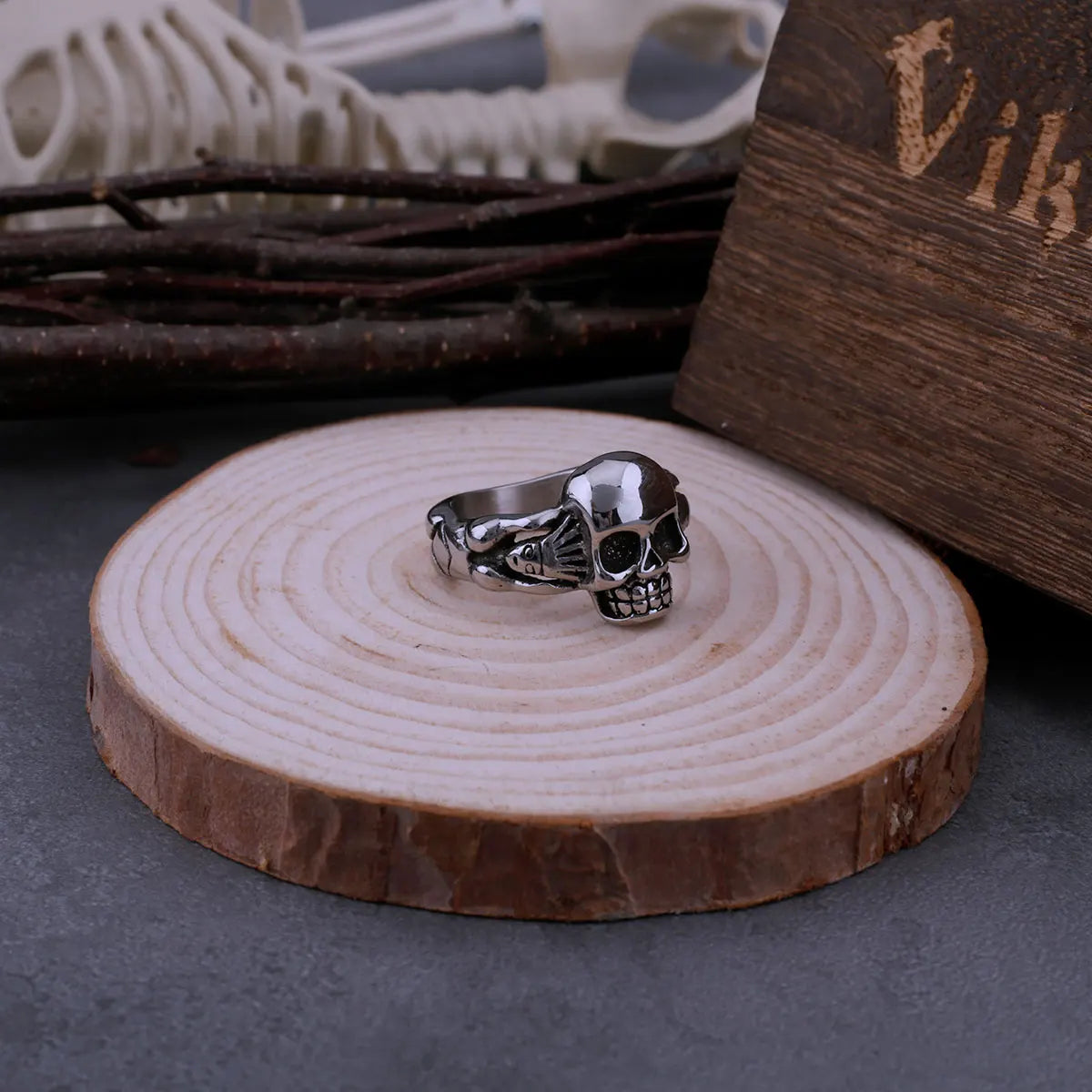 Hand Holding Skull Ring